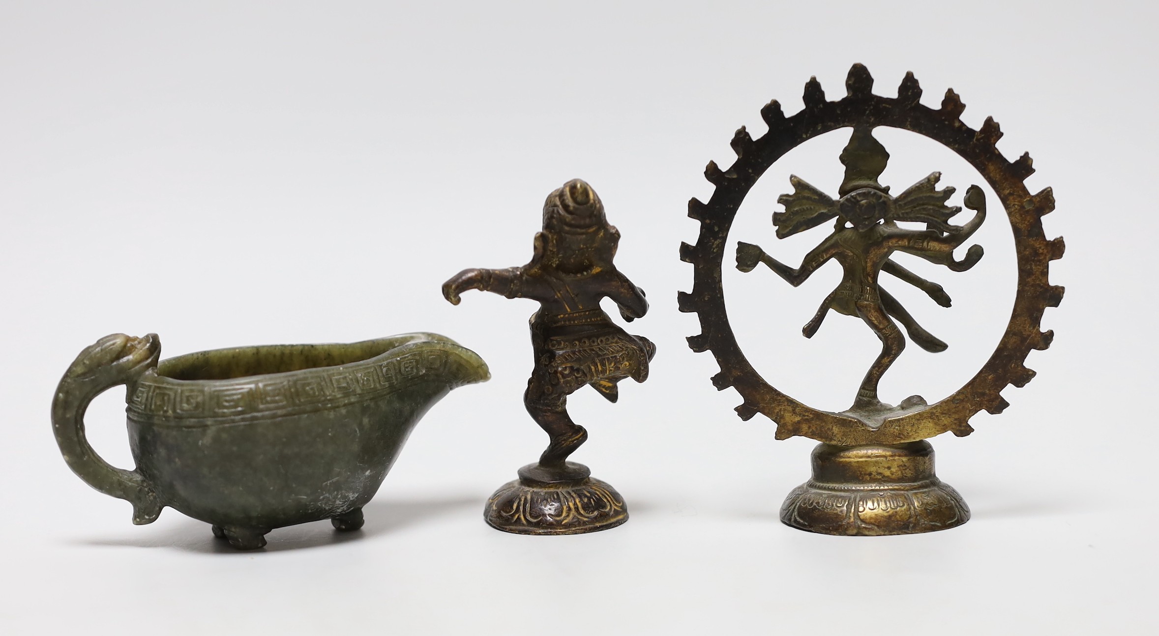 Two Indian bronze deity figures together with a Chinese carved spinach jade jug, tallest 11cm